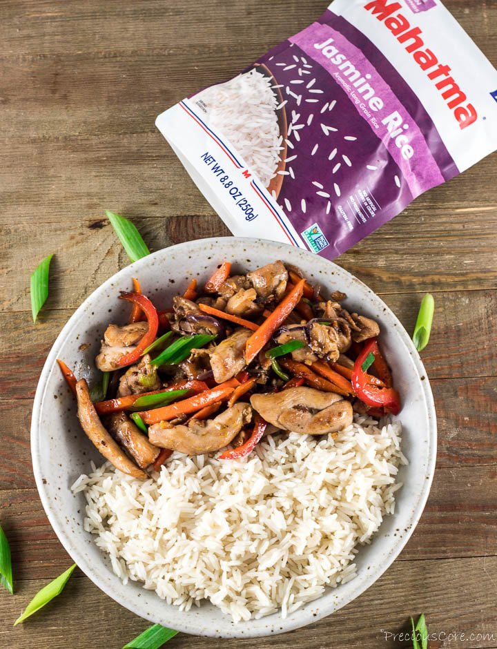 Chicken stir fry and rice in a bowl.