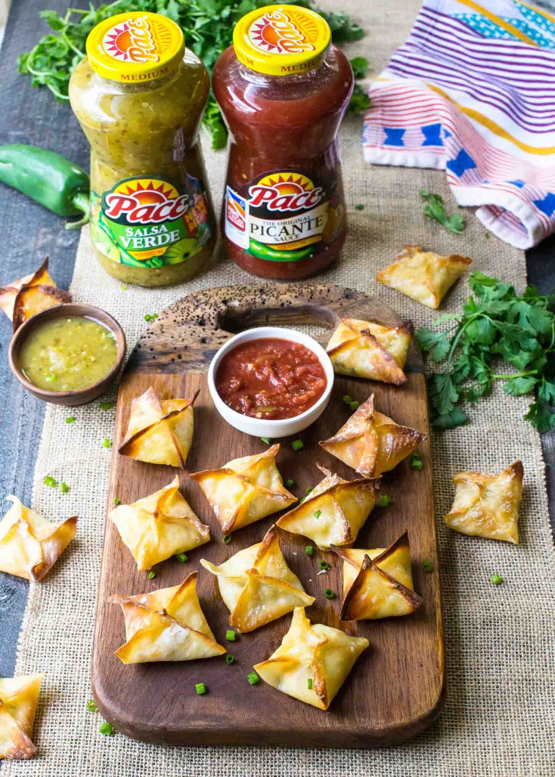 baked wontons with salsa on a table
