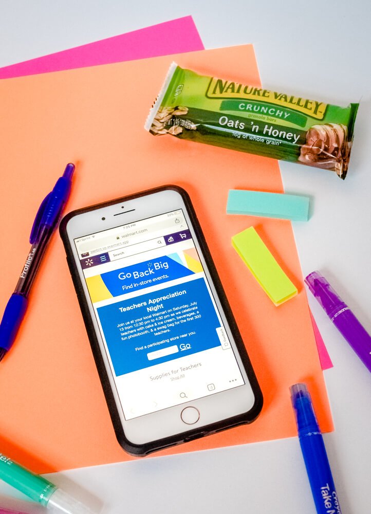 Mobile phone displays web announcement for Walmart teacher appreciation event.