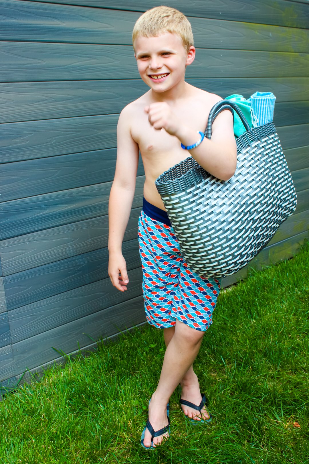 A boy carries his travel kit