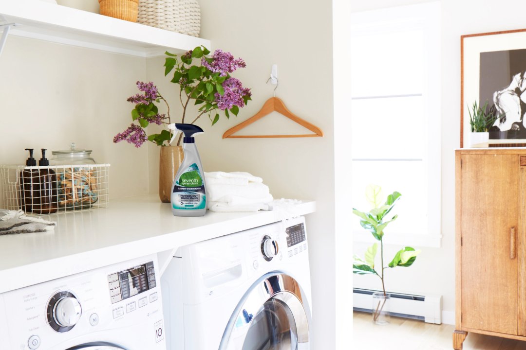 stain spray bottle in laundry room on top of washer/dryer