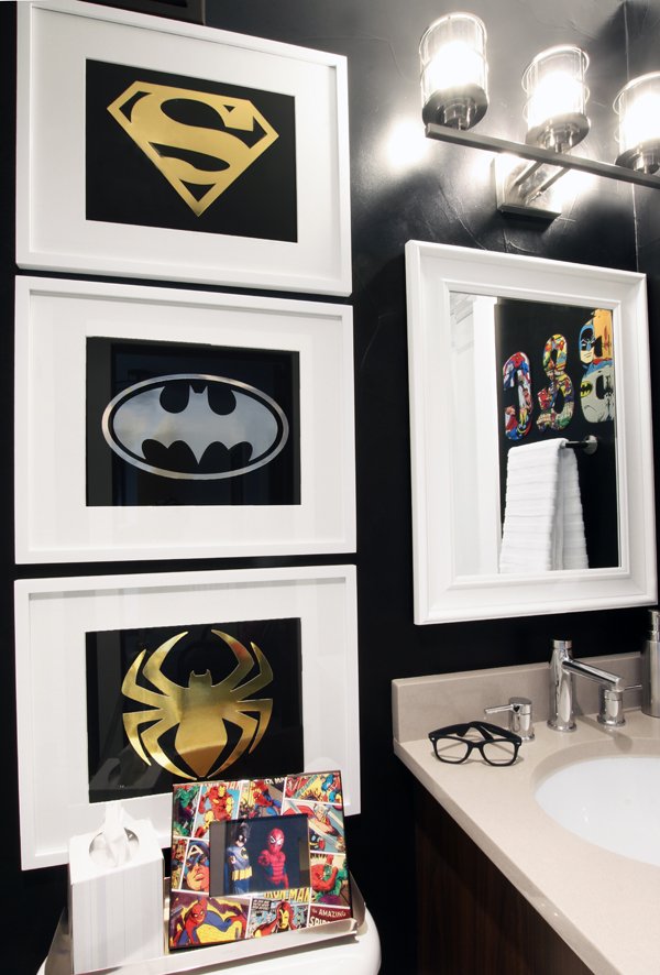 Sophisticated Superhero bathroom with DIY superhero art and black walls