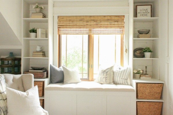 Farmhouse Master Bedroom | farmhouse shelving | builtin shelves | bright and cozy bedroom | master bedroom | farmhouse style | faux beams | faux fireplace | farmhouse bedroom | farmhouse window seat | window seat | master bedroom remodel | master bedroom makeover | white bedroom