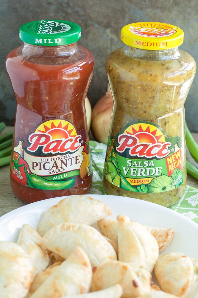 Empanadas with 2 jars of salsa. 