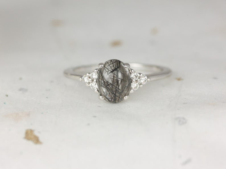 Quartz gemstone engagement ring with diamond clusters