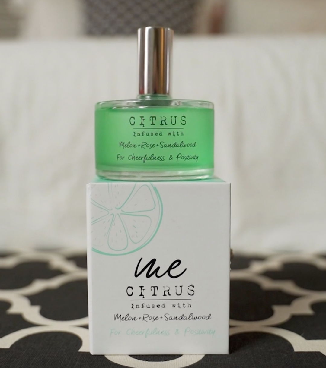 A bottle of citrus scent perfume.