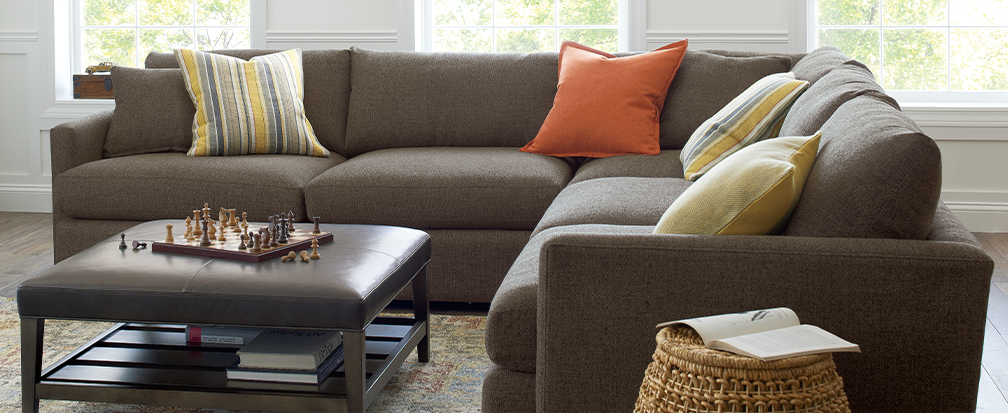 Kid & Pet Friendly Furniture | Crate and Barrel - Lounge II brown sectional couch with plush leather ottoman