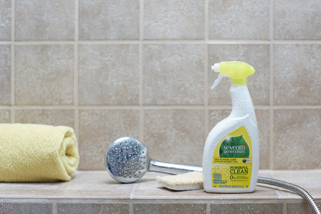 tub and tile cleaner on bathroom tub rim